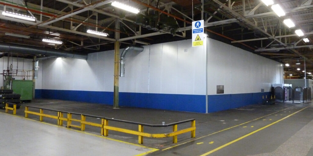 Area of warehouse created using Flexiwall with ventilation pipe.